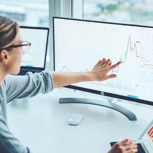 Woman looking at graphs in the monitor